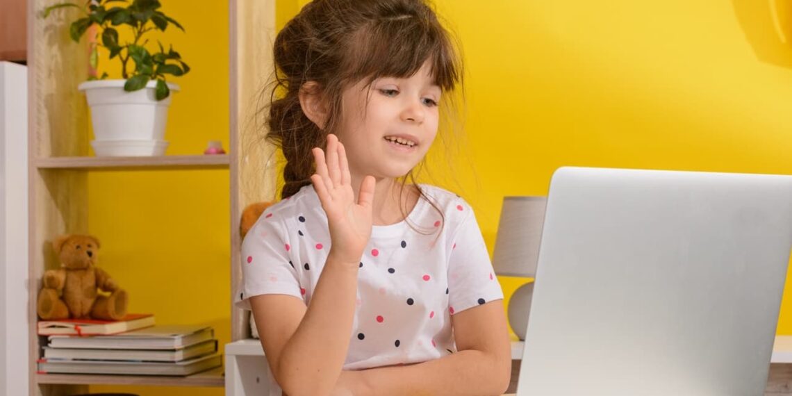 Online lessons for children. Homeschooling and distance education for kids. Girl student study online with video call teacher.