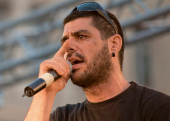 In this photo dated June 21, 2011, rapper Pavlos Fyssas performs on stage. Fyssas, a hip-hop singer with the stage name Killah P and described as an anti-fascist activist, died early Wednesday Sept 18 from two stab wounds to the chest after leaving a cafe in the western area of Keratsini. Police arrested a suspect at the scene, who they say admitted to the killing and identified himself as a member of Golden Dawn. (AP Photo/John D. Carnessiotis)
