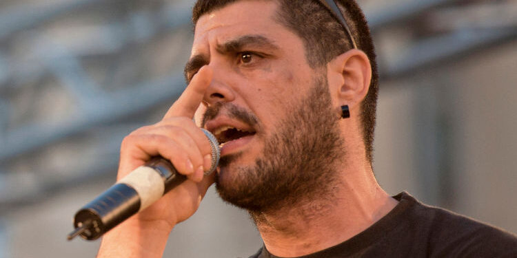 In this photo dated June 21, 2011, rapper Pavlos Fyssas performs on stage. Fyssas, a hip-hop singer with the stage name Killah P and described as an anti-fascist activist, died early Wednesday Sept 18 from two stab wounds to the chest after leaving a cafe in the western area of Keratsini. Police arrested a suspect at the scene, who they say admitted to the killing and identified himself as a member of Golden Dawn. (AP Photo/John D. Carnessiotis)