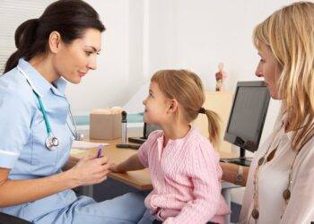 British nurse about to inject young child; Shutterstock ID 98521163; PO: The Huffington Post; Job: The Huffington Post; Client: The Huffington Post; Other: The Huffington Post