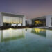 Modern house with garden swimming pool and wooden deck